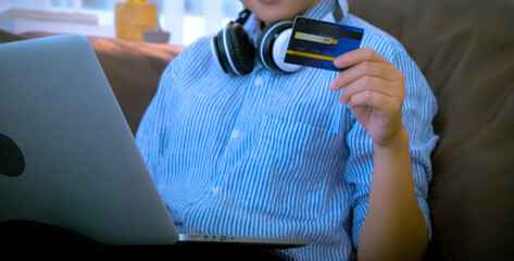 Using a credit card to buy things online for your holiday at home for pleasure and as a business online.
