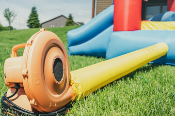 Subject focus on bouncy house blower fan