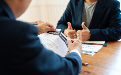 Businessmen tear up contract documents after negotiation fails.