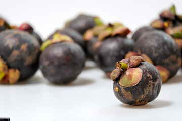 Close-Up Of Mangosteen Fruits On Table