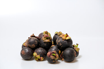 Close-Up Of Mangosteen Fruits On Table