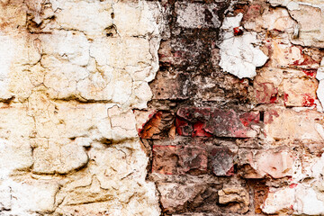 Weathered texture of stained old orange and white brick wall background