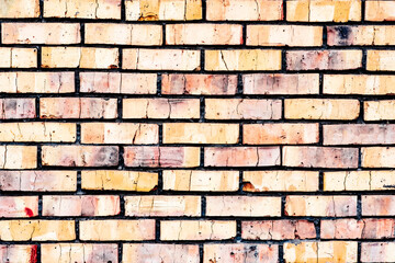 Fototapeta premium Weathered texture of stained old orange and white brick wall background