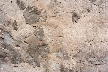 Texture of a concrete wall with cracks and scratches which can be used as a background