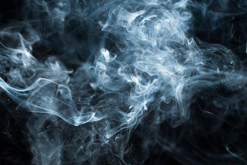 Photo of a wisp of smoke on a dark background