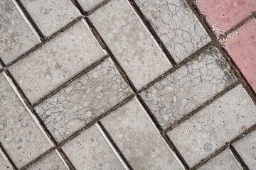 Background image of texture of pedestrian footpath covered by paving tiles