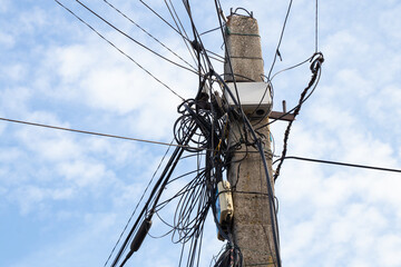 pole with many wires against the sky in Ukraine