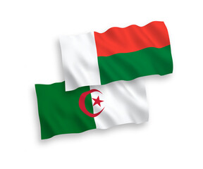 Flags of Madagascar and Algeria on a white background