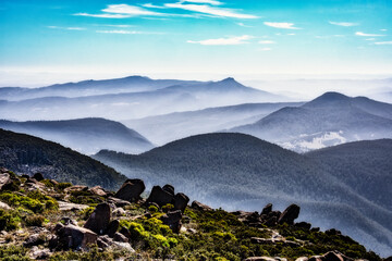 View from top of kunanyi/Mt Wellington Tasmania. Low lying clouds and mist in the valleys give a surreal and peaceful feeling.