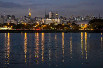 Fototapeta na wymiar Sao Paulo, Brazil, August 13, 2013. Night view lake in Ibirapuera Park and Sky line of city in Sao Paulo