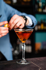 barista making cocktail in the bar