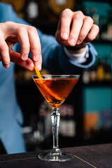 barista making cocktail in the bar