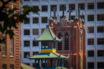 Modern buildings, historic Chinese pagoda and tower of Old Saint Mary's Cathedral in Chinatown San...