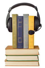 Headphones with a microphone and a stack of books isolated on white background.