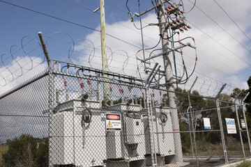 High voltage electicity substation surounded by fence