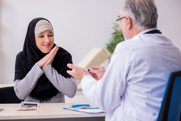Arab woman visiting experienced doctor