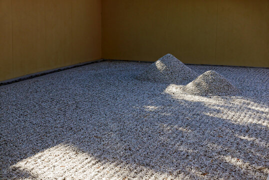 two gravel mounds in a Japanese garden