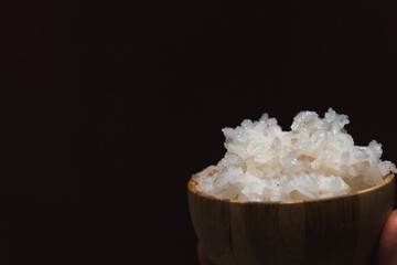 Healthy food. Wooden bowl with parboiled rice. Rice close-up