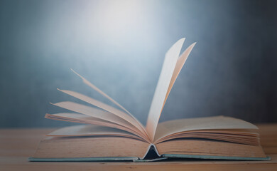 book opening on table education and learning concept