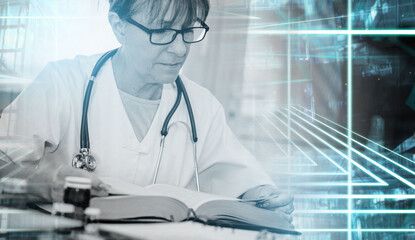 Female doctor reading a textbook; light effect; multiple exposure