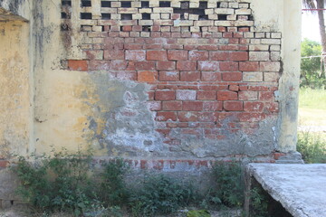 old brick wall with graffiti