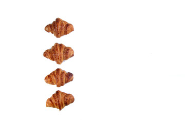 four croissants isolated on white background flat lay