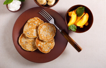 Banana and sultana pancakes with fruit topping
