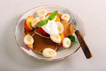 Pancakes with banana and nectarine topping