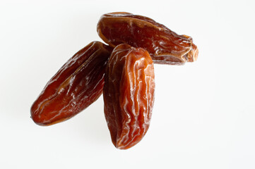 dried date fruits on a white background