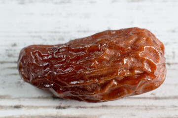 dried date fruits on a white background