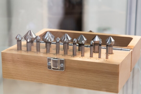 Shop window, production and sale of working tools and equipment. Large varied industrial assortment conical zinker set, wood and metal burr