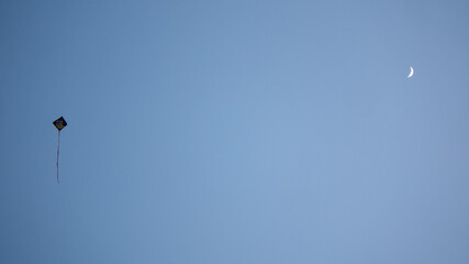 kite in the sky and moon