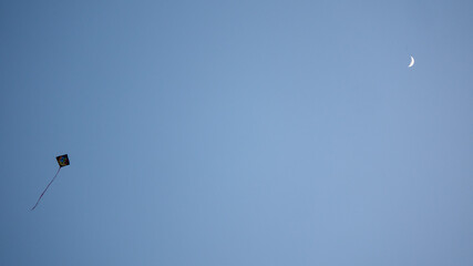 kite in the sky and moon