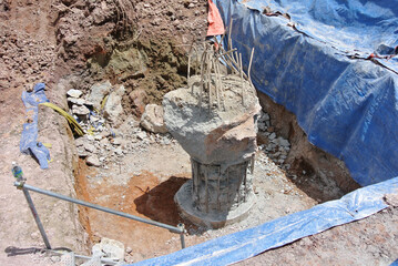 JOHOR, MALAYSIA -MARCH 28, 2016: Excavated and cut to level bore pile at the construction site. Ready to construct a pile cap reinforcement bar as the next step of work. 