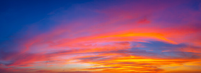 Beautiful sunset sky above clouds with dramatic light
