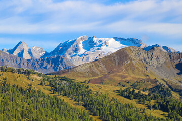 Beautiful Dolomites in Italy. Clear day with blue sky. Mountains are illuminated by the rays of the sun. Clean fresh air. Selective focus.