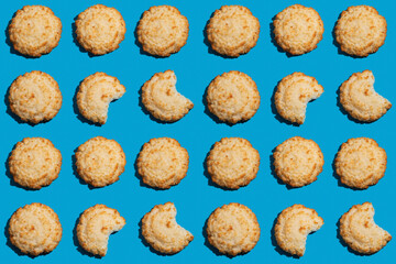 Bitten coconut cookies as pattern background