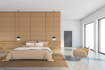 Beige tile and white bedroom with armchair