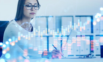Woman in glasses working in office, growing graph