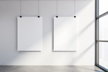 Two mock up poster in white wall room