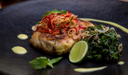 Grilled spicy fish fillet steak. Indonesian food. Delicious healthy eating.