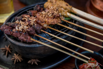 Meat skewers in a herb marinade on a grill pan. Meat kebab
