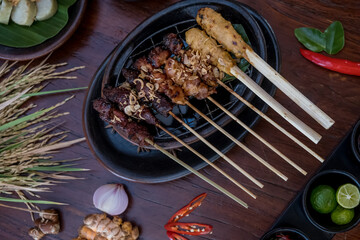 Meat skewers in a herb marinade on a grill pan. Meat kebab