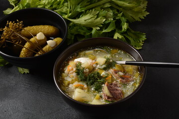 Soup with beef meat, pickled cucumbers and pearl barley.  Rassolnik- traditional Russian cuisine