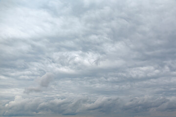 white fluffy clouds in the blue sky.