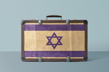Israel flag on old vintage leather suitcase with national concept. Retro brown luggage with copy...