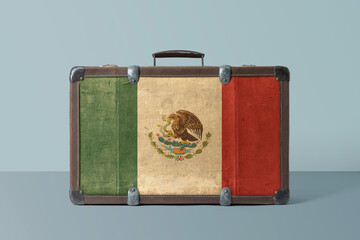 Mexico flag on old vintage leather suitcase with national concept. Retro brown luggage with copy...