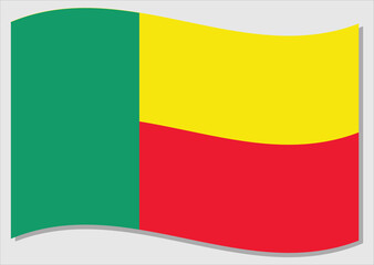 Waving flag of Benin vector graphic. Waving Beninese flag illustration. Benin country flag wavin in the wind is a symbol of freedom and independence.