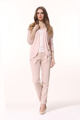 business woman executive posing in summer pink pant suit full body length