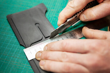 Leather Craftsman working with leathet.
